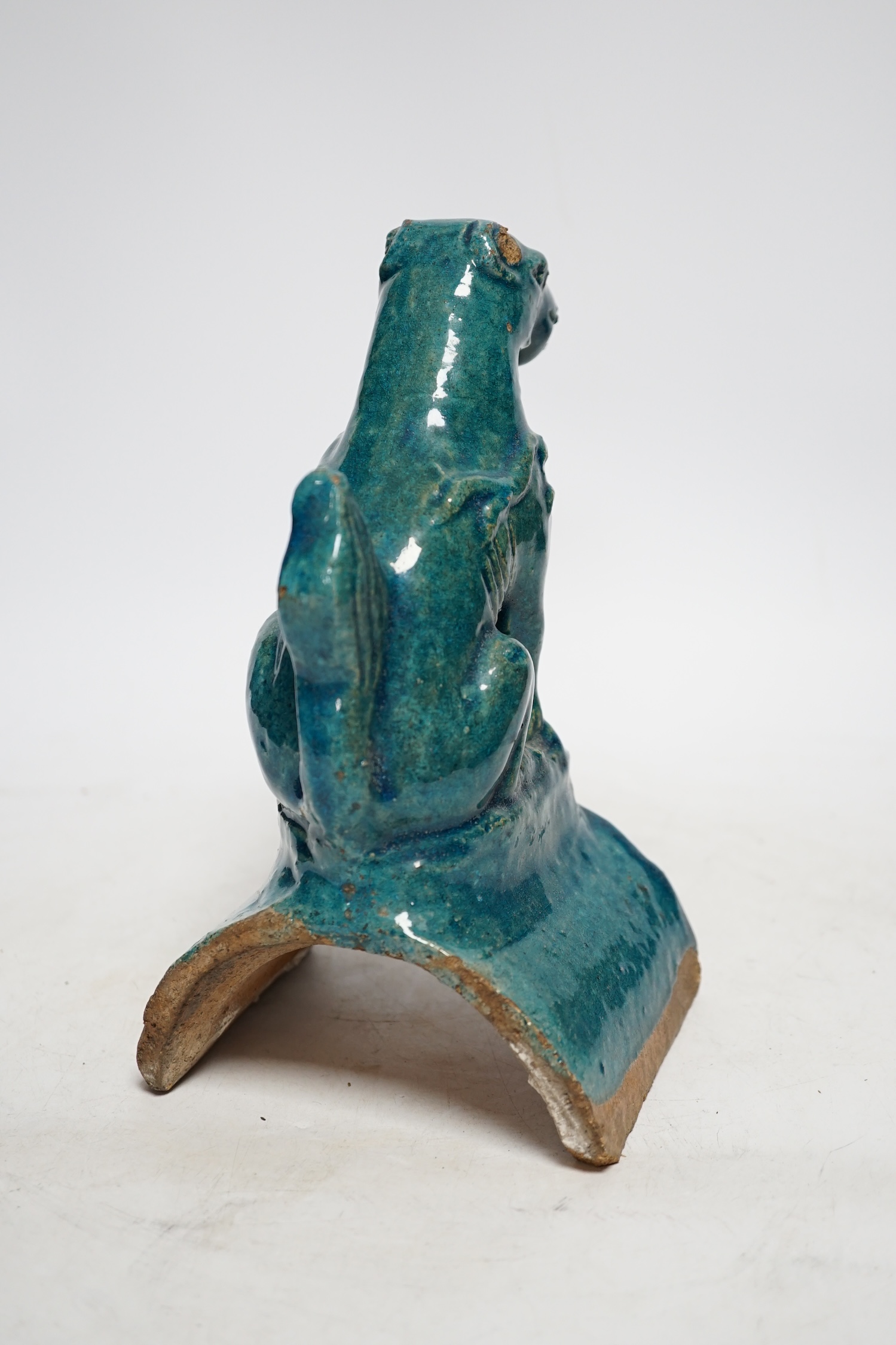 A Chinese turquoise glazed lion-dog ridge tile, Ming dynasty, 22cm high